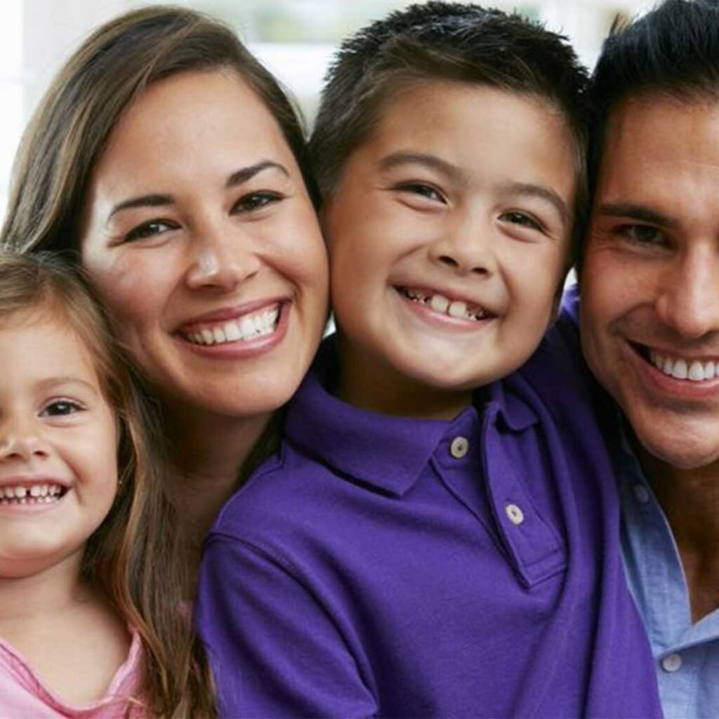 A happy family receiving affordable dental care in Oceanside CA at Mission Dental Care.
