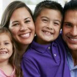 A happy family receiving affordable dental care in Oceanside CA at Mission Dental Care.