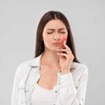 A dentist explaining root canal therapy coverage to a patient at Mission Dental Care in Oceanside, CA.