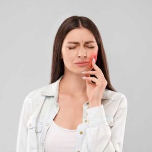 A dentist explaining root canal therapy coverage to a patient at Mission Dental Care in Oceanside, CA.