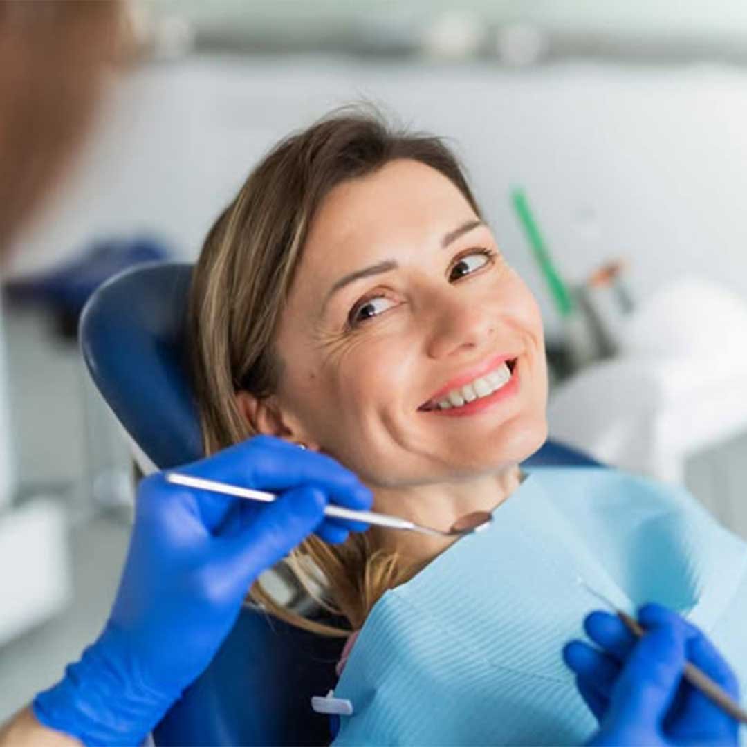 Dr. Rios, a bilingual Spanish-speaking dentist in Oceanside CA, consulting with a patient at Mission Dental Care.